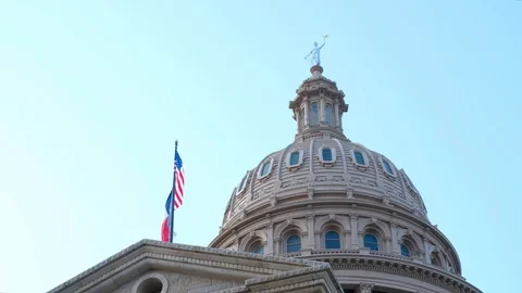 View of Austin Capitol with flags of Texas and USA Stock Footage 110778632
