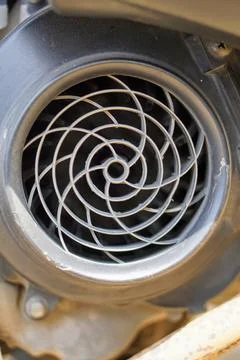 View of an automatic scooter engine cooling fan cover with a spiral pattern. 스톡 사진