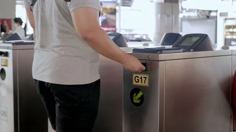 View to an automatic ticket gate of subway transportation while a man walking Stock Footage 218361260