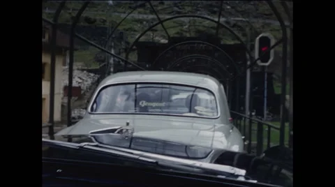 View from Automobile Aboard a Train Exit Tunnel in Switzerland 1957 Video stock 48069212