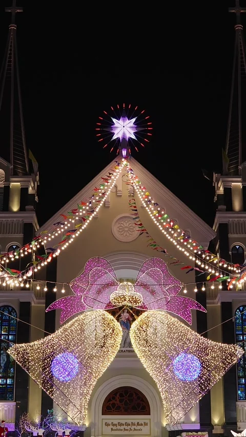 View of Ba Lang catholic church faсade on Christmas Eve, Nha Trang, Vietnam Stock Footage 336664463
