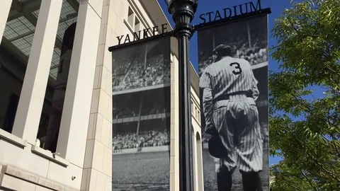 View of Babe Ruth sign and pan down to Yankee Stadium as fans get ready for Stock Footage 83551675