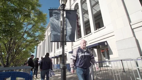 View of Babe Ruth sign and Yankee Stadium as fans get ready for Yankees Bronx Stock Footage 83553014