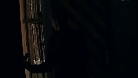 View from the back, the artist comes out behind the scenes onto the stage with a Stock Footage 80717008