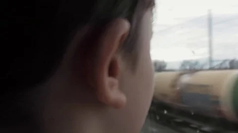 View From the Back. Boy in the Passenger Car Looking Out Through the Train Wi 스톡 동영상 84852067