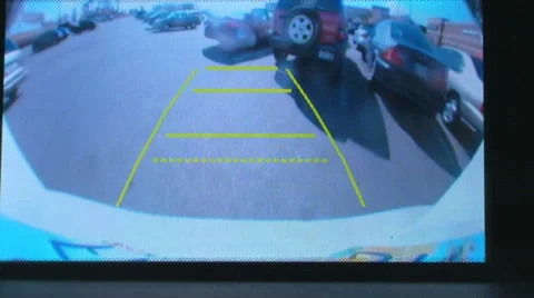 View from back-up cam while backing out of a parking spot. Stock Footage 28704335