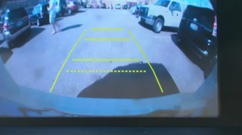 View from back-up cam while backing up around a shopping center Stock Footage 28710930
