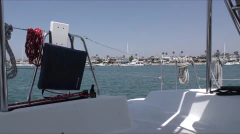 View of back of catamaran looking from port aft area through ropes and life l Stock Footage 67490993