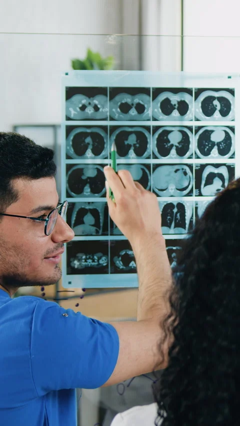 View from back of confident high-skilled diverse male and female medical workers Stock Footage 329568494