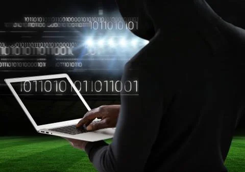 View from the back of hacker using a laptop Foto stock