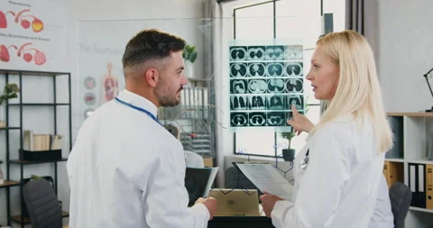 View from back on likable satisfied professional successful male and female Stock Footage 160426235