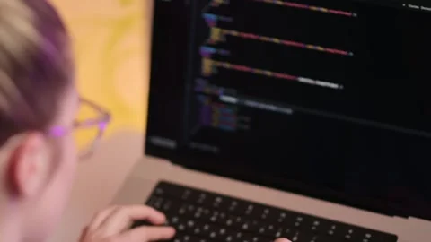 View from the back of a multitasking woman programmer Stock-Footage 219851121