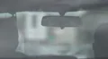 View from back seat of auto, driver waiting for pedestrians crossing road slowly HD Footage