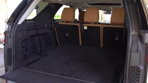 View of back seats automatically unfolding inside mini van vehicle. Stock-Footage 80979100