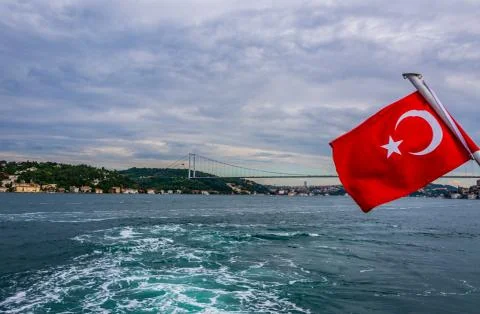 View to the back of the ship with raised turkish flag in Istanbul Stock Photos