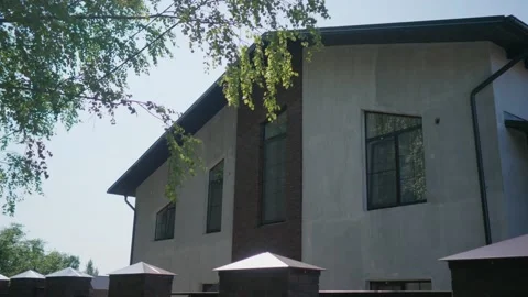 View of the back side of a private house from behind fences. Back entrance. Stock Footage 169484517