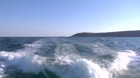 View from back from speeding boat showing coastline Stock Footage 277530109