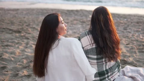 The view from the back, two beautiful women, a mother and daughter, look at the Stock Footage 229321817