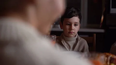 View from back of unrecognizable mother cheerful talking to cute child son story Stock Footage 165579114