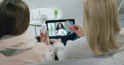View from back where careful confident calm mother and sick teen daughter Stock Footage 144638951