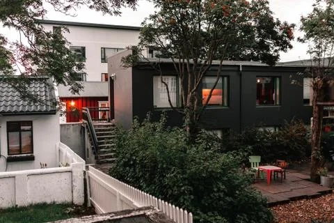 View of the back yard with trees and a flat lawn Stock Photos