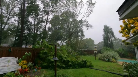 View of a backyard during a Cat 1 hurricane Stock Footage 305187330