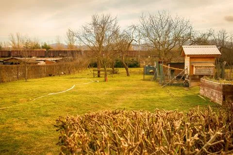 View of the backyard garden in early spring. Stock Photos