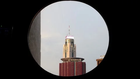 A view of the Baiyoke skyscraper through an round window Stock Footage 318405647