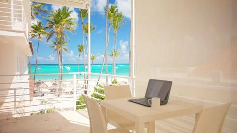 View of a balcony with a laptop on the table for remote online work. Apartment 스톡 사진
