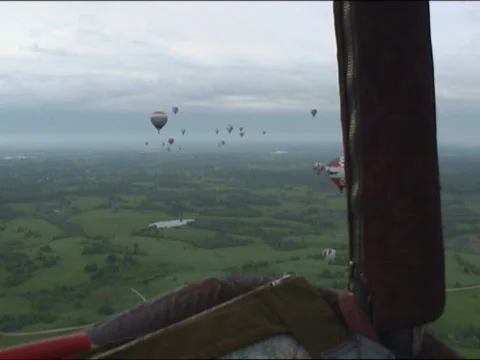 view from a balloon basket on the other balloons Stock Footage