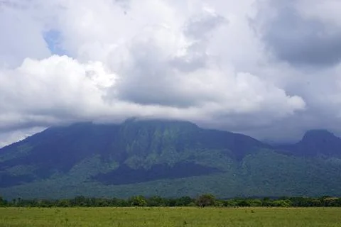View of the Baluran Mount in the background of cloudy sky, Java, Indonesia 스톡 사진