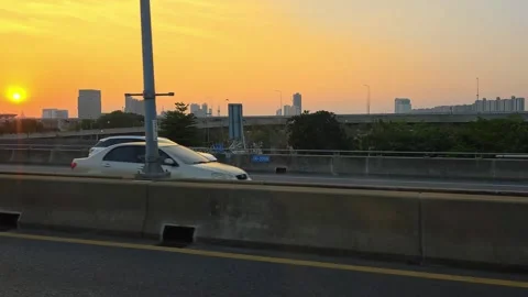 View of Bangkok through the car window. Sunset. Video stock 330628990