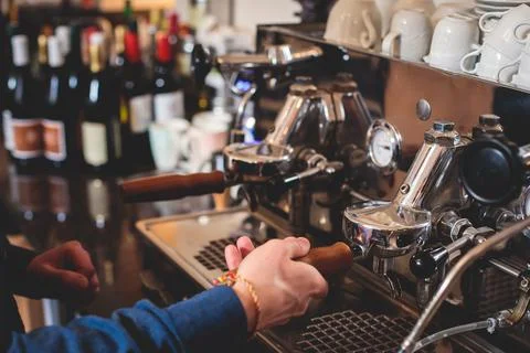 View of barista working at coffee machine in coffee house bar, bartender ba.. Stock Photos