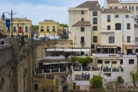 View on bars en restaurants next to Puenta Neuvo in Ronda, Spain Stock Photos