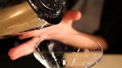 View of bartender pours coffee cocktail into glass Stock Footage 43245593