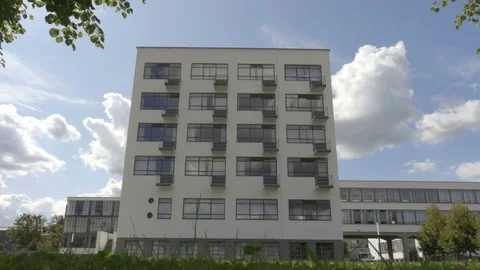 View on the Bauhaus facade from below with the cloudy sky on the background Stock Footage 83633440