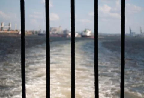 View of a bay through an iron window Stock Photos