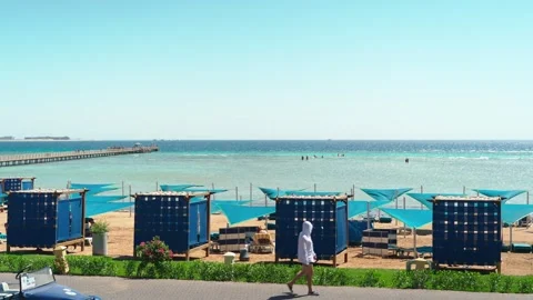 View of the beach and pier of Gravity Aqua park Hotel. Summer holidays. Видео 341916589