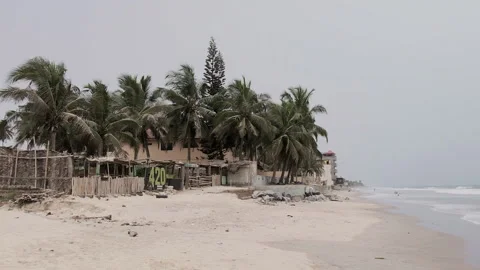 View of beach bar, palm trees and waves at Kokrobite Beach, Ghana Video stock 274459752