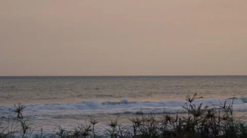 View of the beach with calm waves in the afternoon Stock Footage 274646370