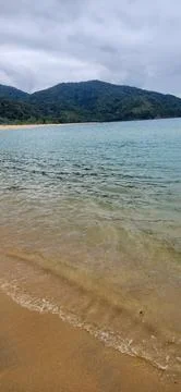 View of the beach on a cloudy day. Stock Photos