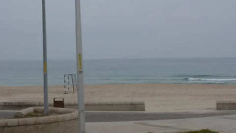 View of the beach with exercise equipment on a cloudy winter day Stock-Footage 258467059