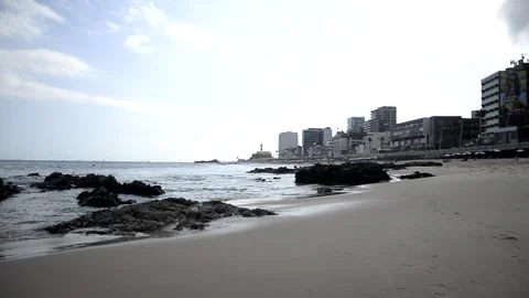 View of the beach full of people at Farol da Barra in Salvador, Bahia. Stock Footage 248929489