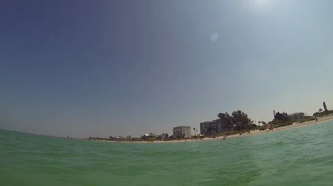View of beach goers from a paddle board Stock Footage 37664752
