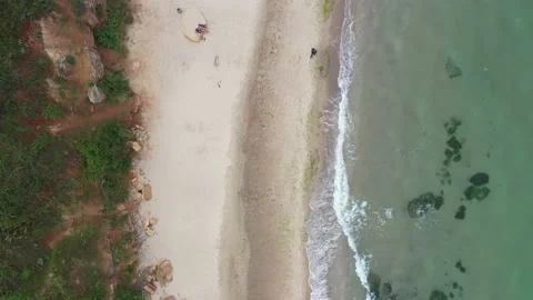 View of the beach from a height. Sea surf and empty sea beach. Stock Footage 157087998