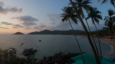 View on a beach from the hill at sunset Vídeos de archivo 129754463
