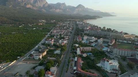 View of the beach on the Mediterranean coast at dawn. Pier, mountains, Turkey 4k Stock Footage 217869190