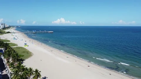 The view of the beach , pier and lighthouse at the horizon Stock Footage 162480603
