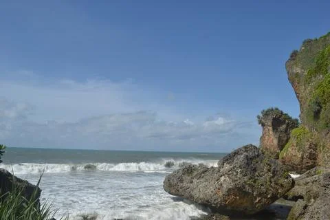 View of the beach with rocky ledges Stock Photos