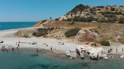 View of the beach from the sea. A huge stone in the sea. Aerial photography. 4K Stock Footage 104655838